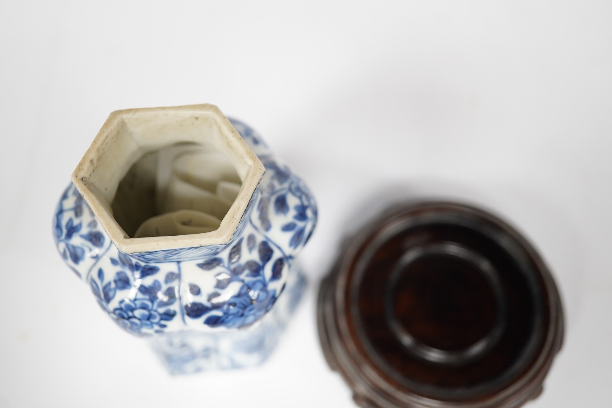 A Chinese blue and white hexagonal jar, Kangxi period and stand, 10cm high. Condition -small firing crack to inside edge of foot, otherwise good